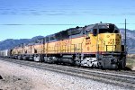 Union Pacific WB with DD35A #78. Large cement pickup from Victorville area on head end.